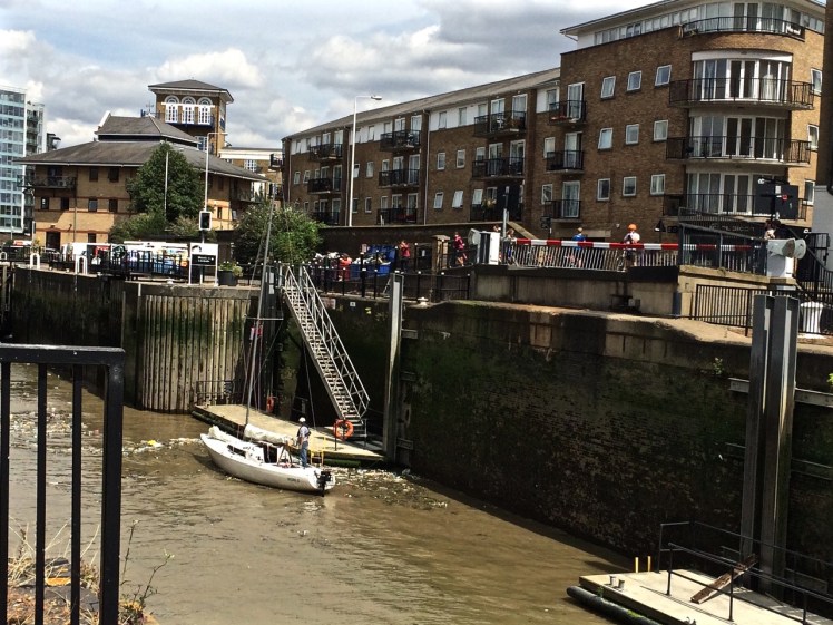 Yacht entering Limehouse Basin Thames River bike ri